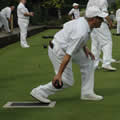 A person in mid bowling action
